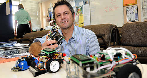 Gympie High science teacher Tony Grudzinski shows some of the robots his STEM students made. Gympie High science teacher Tony Grudzinski shows some of the robots his STEM students made.